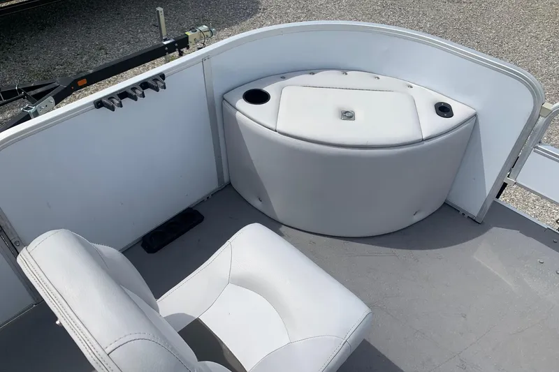 Slide: The Image of Interior of a 2019 YAMAHA G3 V22FC boat with white seating and storage. - 8