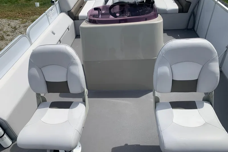 Slide: The Image of Interior of a 2019 YAMAHA G3 V22FC boat with two white seats. - 9