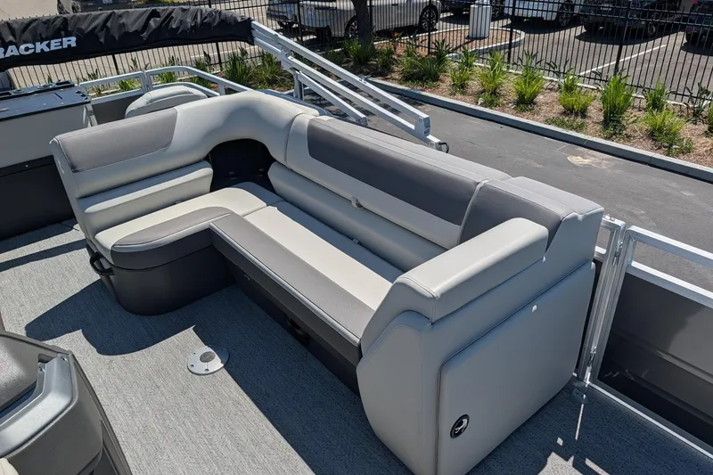 Slide: The Image of 2026 Sun Tracker Fishin' Barge 22 DLX with comfortable seating and modern design. - 11