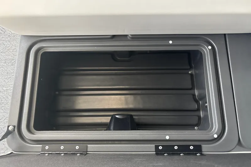 Slide: The Image of Storage compartment of 2026 Sun Tracker Fishin' Barge 22 DLX boat. - 29