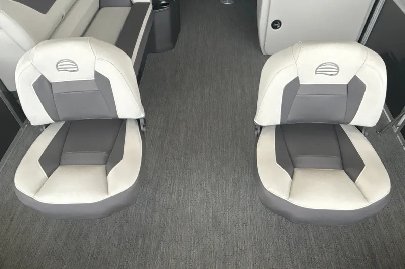 Slide: The Image of 2026 Sun Tracker Fishin' Barge 22 DLX interior with two cushioned seats. - 13