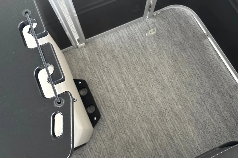 Slide: The Image of Interior view of 2026 Sun Tracker Fishin' Barge 22 DLX with carpeted flooring. - 39