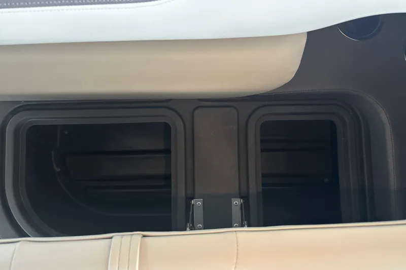 Slide: The Image of Storage compartment in 2026 Sun Tracker Fishin' Barge 22 DLX boat interior. - 35