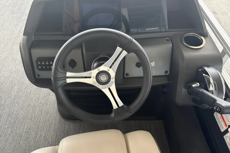 Slide: The Image of Steering console of 2026 Sun Tracker Fishin' Barge 22 DLX pontoon boat. - 19
