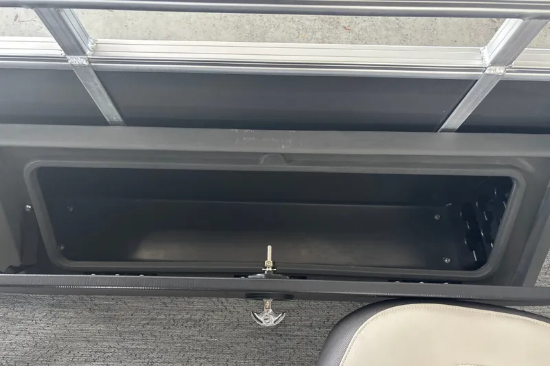 Slide: The Image of Storage compartment on 2026 Sun Tracker Fishin' Barge 22 DLX pontoon boat. - 30