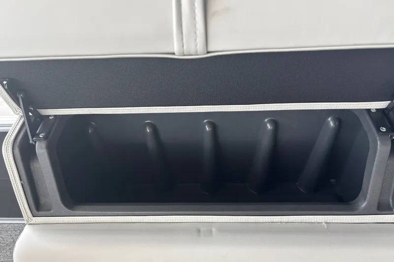 Slide: The Image of Storage compartment in 2026 Sun Tracker Fishin' Barge 22 DLX boat, open and empty. - 28