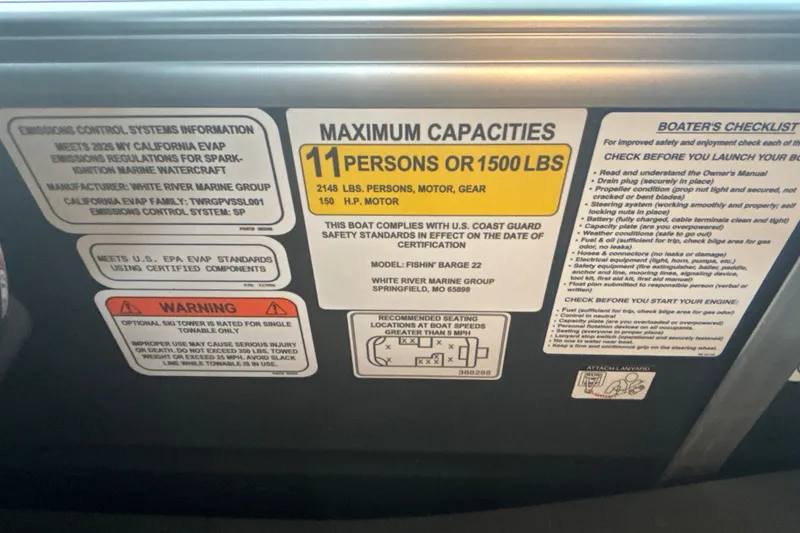 Slide: The Image of Capacity and safety labels on 2026 Sun Tracker Fishin' Barge 22 DLX boat. - 43