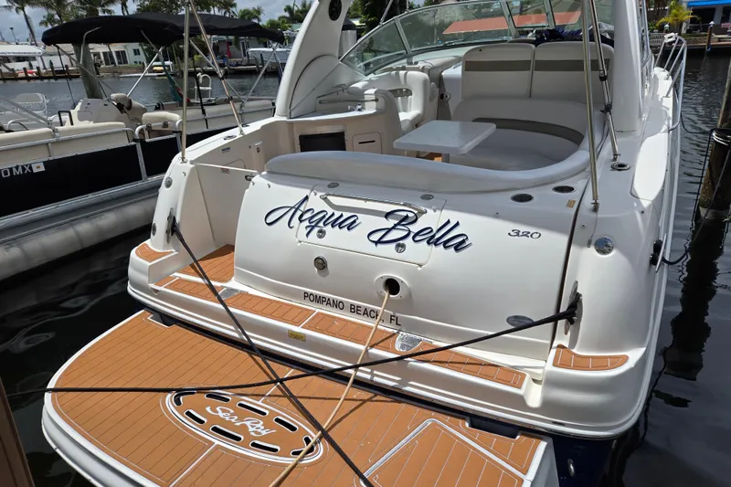 Slide: The Image of 2006 Sea Ray Sundancer 320 boat docked, named "Acqua Bella," in Pompano Beach, FL. - 2