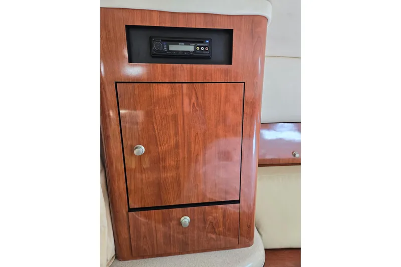 Slide: The Image of Wooden cabinet with stereo system in 2006 Sea Ray Sundancer 320 yacht interior. - 20