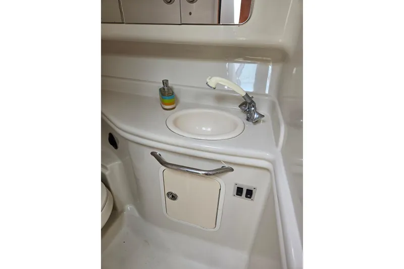 Slide: The Image of 2006 Sea Ray Sundancer 320 bathroom sink with faucet and soap dispenser. - 26