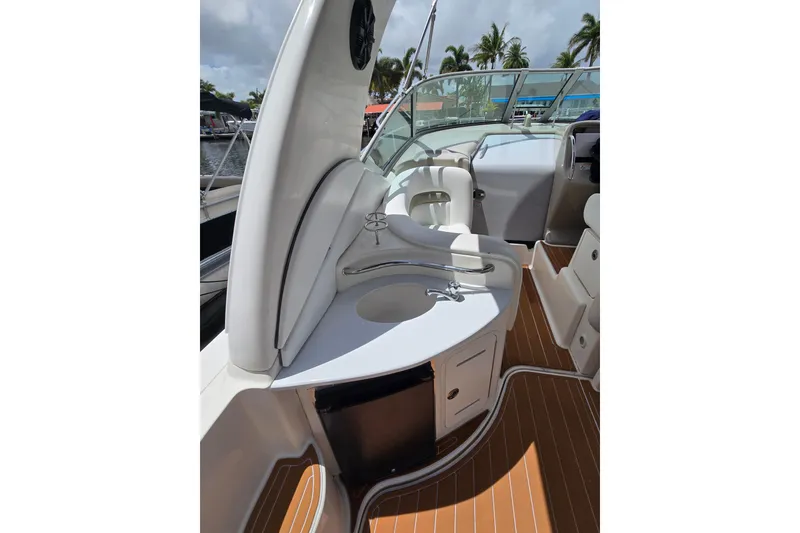 Slide: The Image of 2006 Sea Ray Sundancer 320 boat interior with sink and seating area. - 7