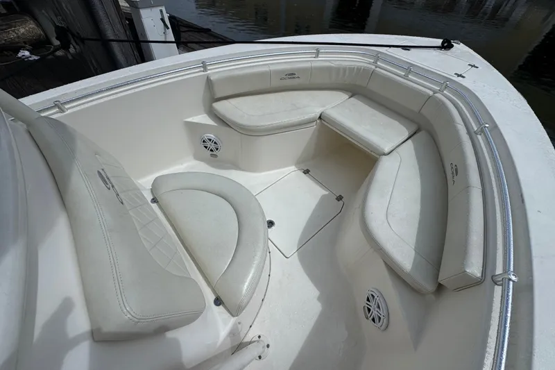 Slide: The Image of 2021 Cobia 237 Center Console boat with spacious seating and storage area. - 7