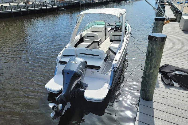 Slide: The Image of 2018 Regal 26 OBX boat docked with Yamaha 300 outboard engine. - 5