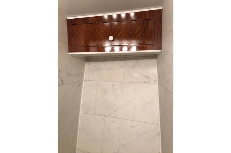 Slide: The Image of Wooden cabinet with marble walls in a 1976 Hatteras 53 Convertible yacht. - 14