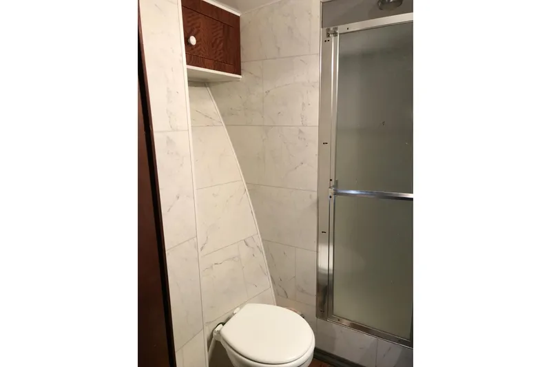 Slide: The Image of Bathroom interior of 1976 Hatteras 53 Convertible yacht with shower and toilet. - 17