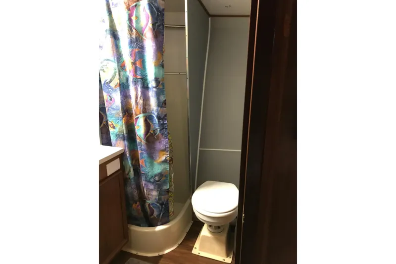Slide: The Image of Bathroom vanity with mirror and lights on 1976 Hatteras 53 Convertible yacht. - 26