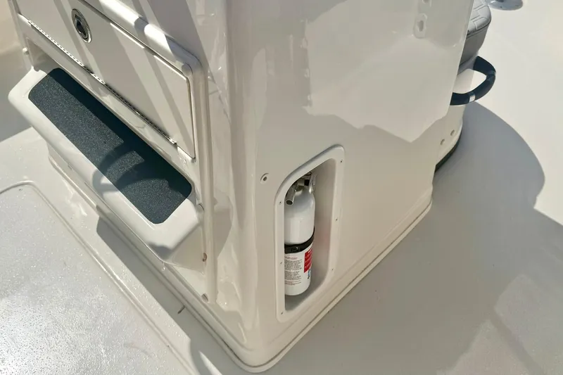 Slide: The Image of 2026 Carolina Skiff 21 Ultra Elite boat console with integrated fire extinguisher. - 20