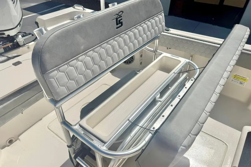 Slide: The Image of 2026 Carolina Skiff 21 Ultra Elite boat seating with storage compartment. - 22