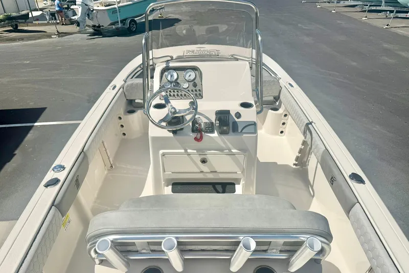 Slide: The Image of 2026 Carolina Skiff 21 Ultra Elite boat interior with steering console and seating. - 23