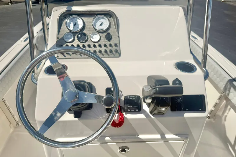 Slide: The Image of Steering console of 2026 Carolina Skiff 21 Ultra Elite boat with gauges and controls. - 3