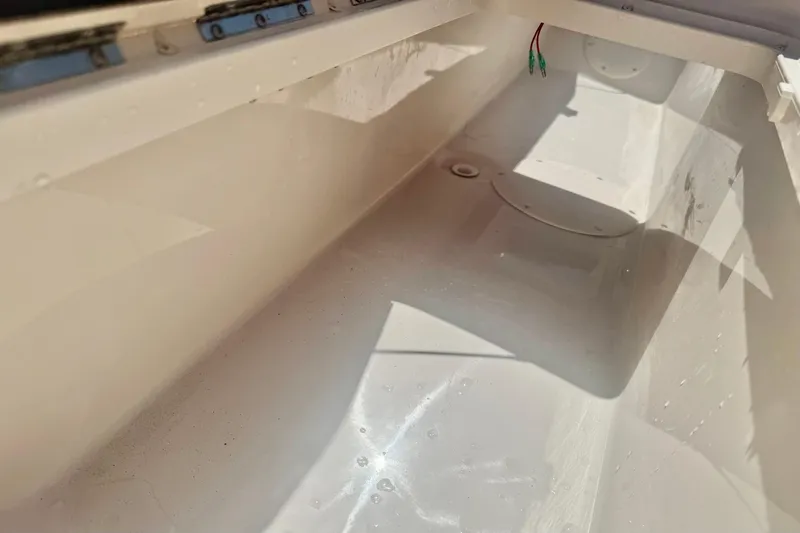 Slide: The Image of Interior view of a 2026 Carolina Skiff 21 Ultra Elite boat compartment. - 31