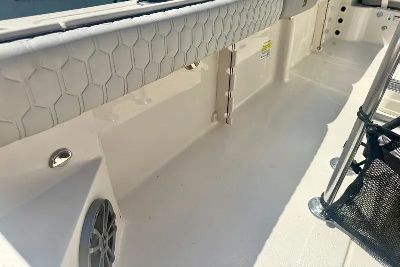 Slide: The Image of 2026 Carolina Skiff 21 Ultra Elite interior with hexagonal pattern upholstery and speaker. - 36