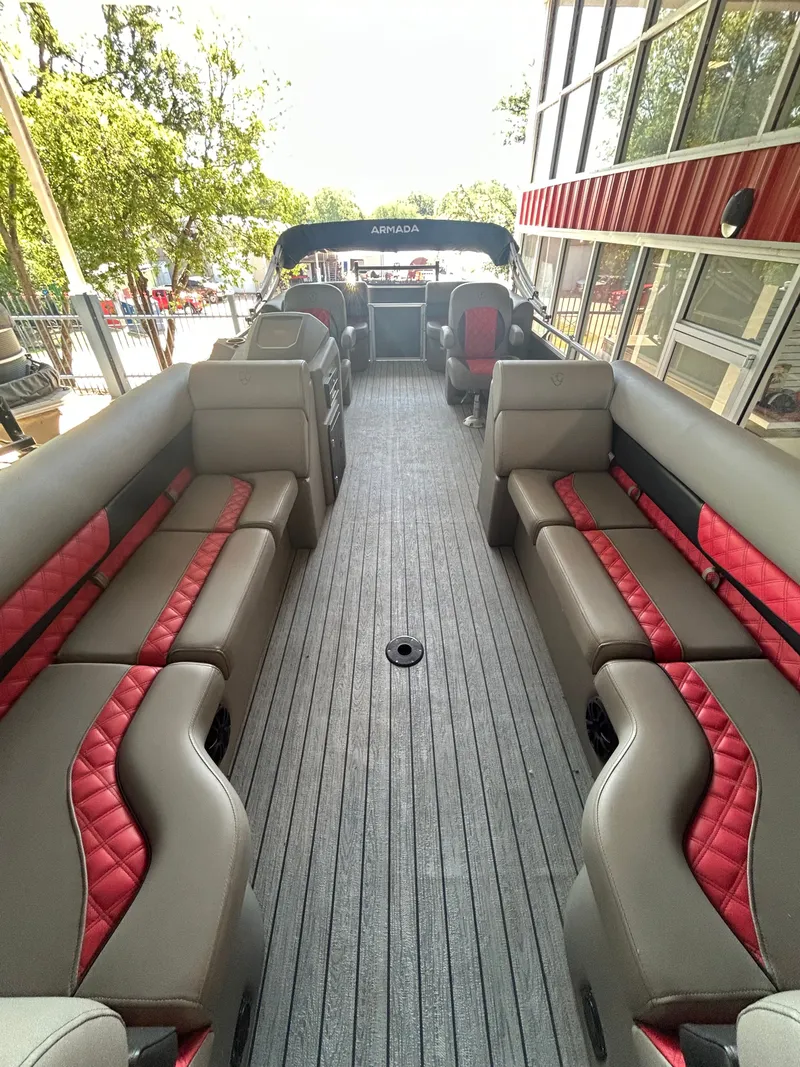 Slide: The Image of Interior of 2025 Armada Drakkar K248 Tritoon with luxurious seating. - 10