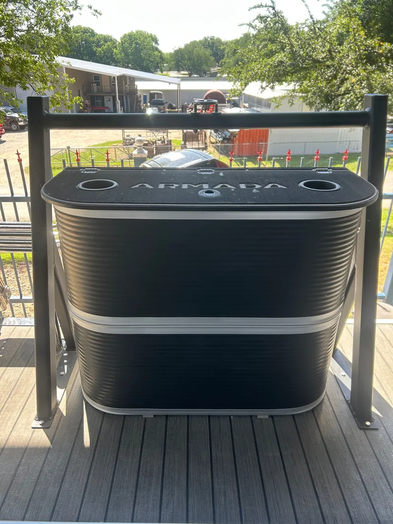 Slide: The Image of Armada Drakkar K248 Tritoon 2025 on a trailer outdoors. - 8