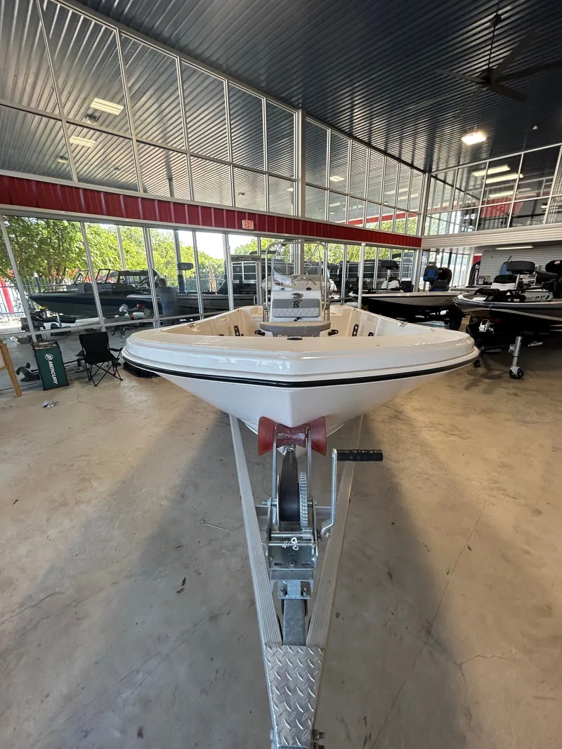 Slide: The Image of 2025 Carolina Skiff 178 JLS CC boat with Suzuki engine in showroom. - 7