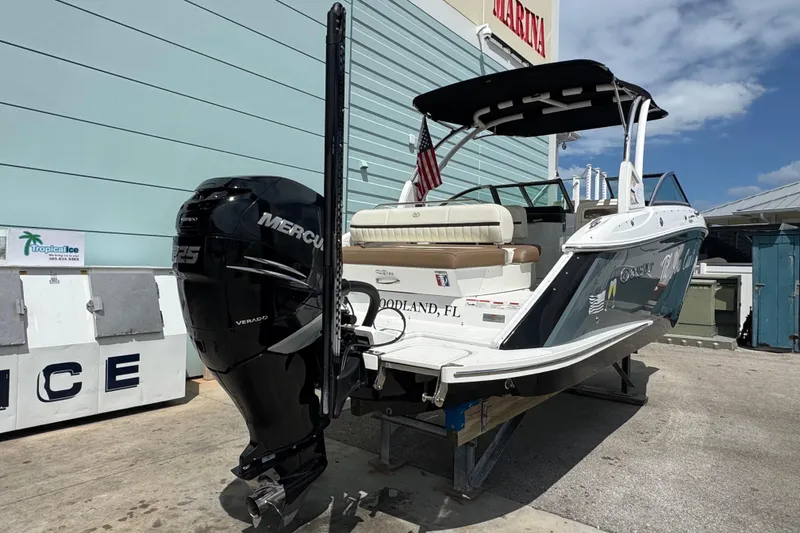 Slide: The Image of 2018 Cobalt 23SC boat with Mercury engine, docked in Florida marina. - 3