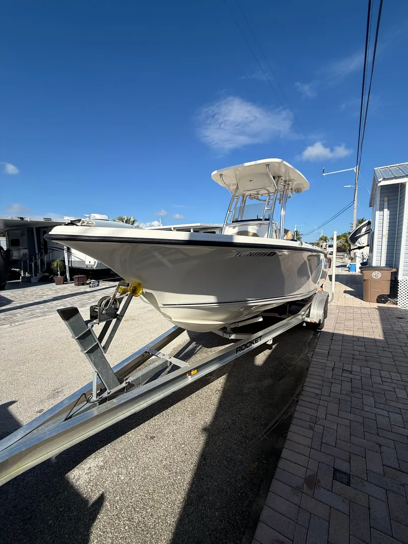 Slide: The Image of 2018 Key West 239 FS boat on trailer under sunny skies. - 8