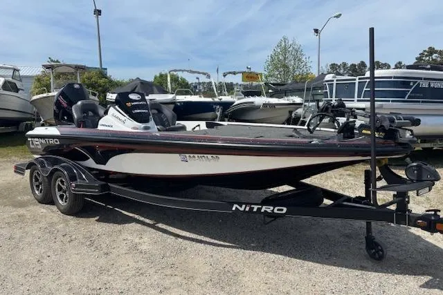 The Image of 2019 Nitro Z19 boat on trailer, parked outdoors with other boats in the background. - 0