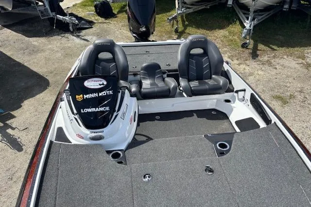 Slide: The Image of 2019 Nitro Z19 boat interior with dual seats and fishing equipment. - 11