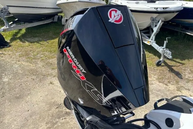 Slide: The Image of Mercury Pro XS outboard motor on a 2019 Nitro Z19 boat, parked near other boats. - 14