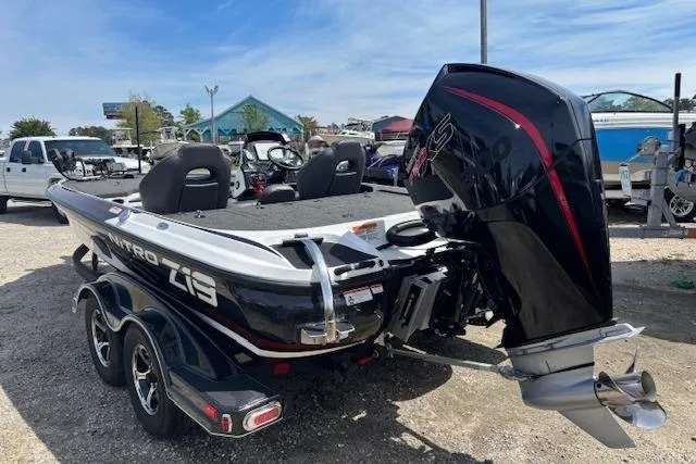 Slide: The Image of 2019 Nitro Z19 boat with powerful outboard motor, parked outdoors on a sunny day. - 3