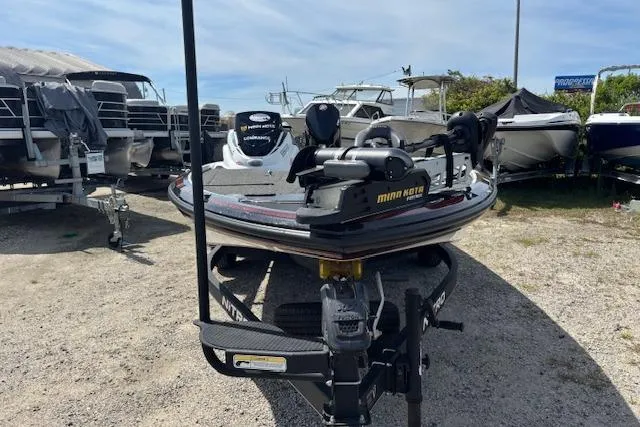 Slide: The Image of 2019 Nitro Z19 boat with Minn Kota motor in a marina setting. - 5