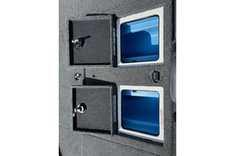 Slide: The Image of 2019 Nitro Z19 boat storage compartments with blue interior and secure locks. - 9