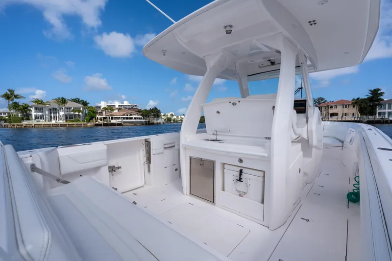 Slide: The Image of 2022 Intrepid 345 Nomad SE boat interior with sleek design and waterfront view. - 30