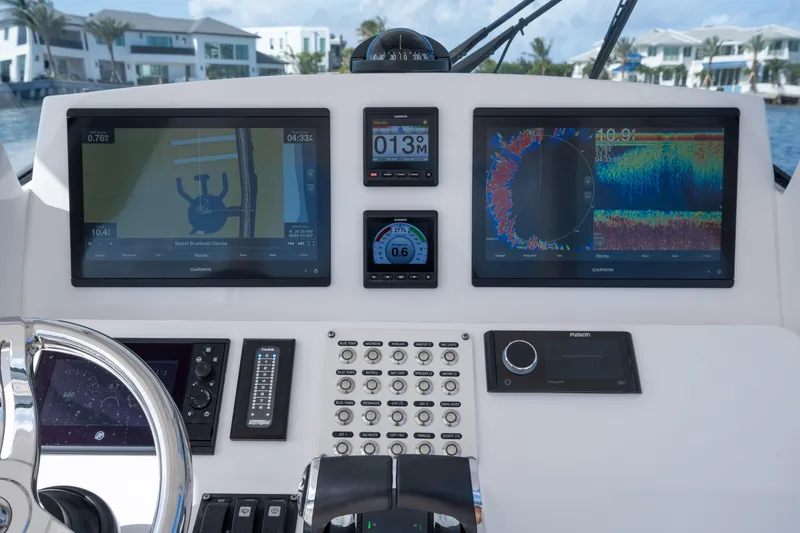 Slide: The Image of Dashboard of 2022 Intrepid 345 Nomad SE with navigation and control screens. - 39