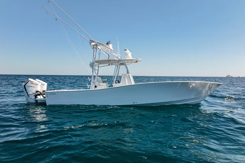 The Image of 2026 Conch 33 boat on open sea under clear blue sky. - 0