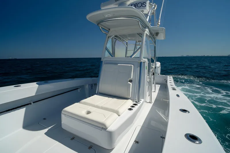 Slide: The Image of 2026 Conch 33 boat cruising on open sea under clear blue sky. - 13