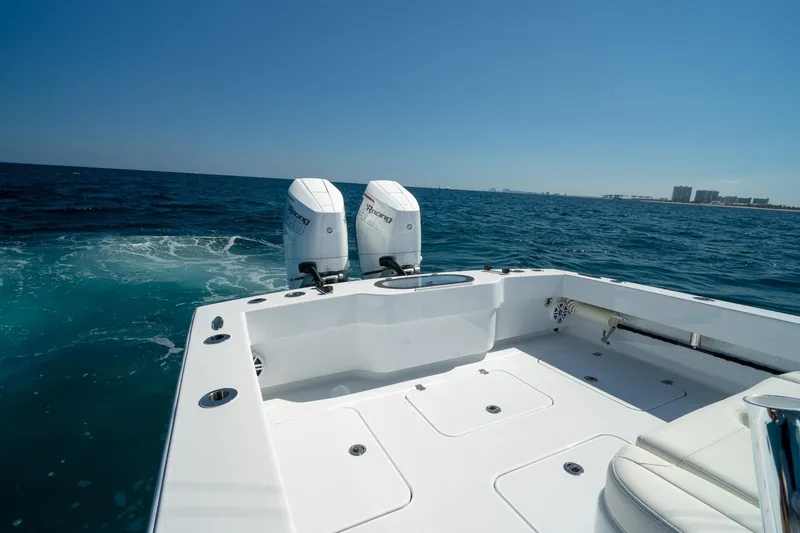 Slide: The Image of 2026 Conch 33 boat with dual engines cruising on open sea. - 16