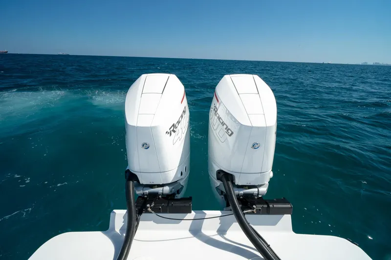 Slide: The Image of Twin outboard motors on a 2026 Conch 33 boat cruising in open ocean. - 18
