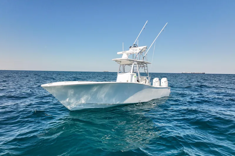 Slide: The Image of 2026 Conch 33 boat on open sea under clear blue sky. - 2