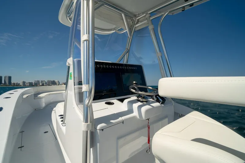 Slide: The Image of 2026 Conch 33 boat helm with modern controls and ocean view. - 22