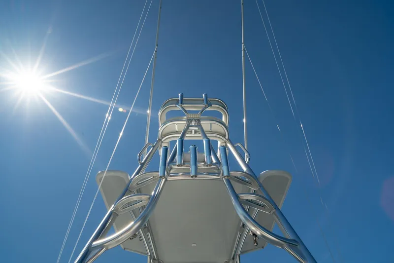 Slide: The Image of Towering structure on Conch 33 boat under bright sun, clear blue sky, 2026 model. - 23