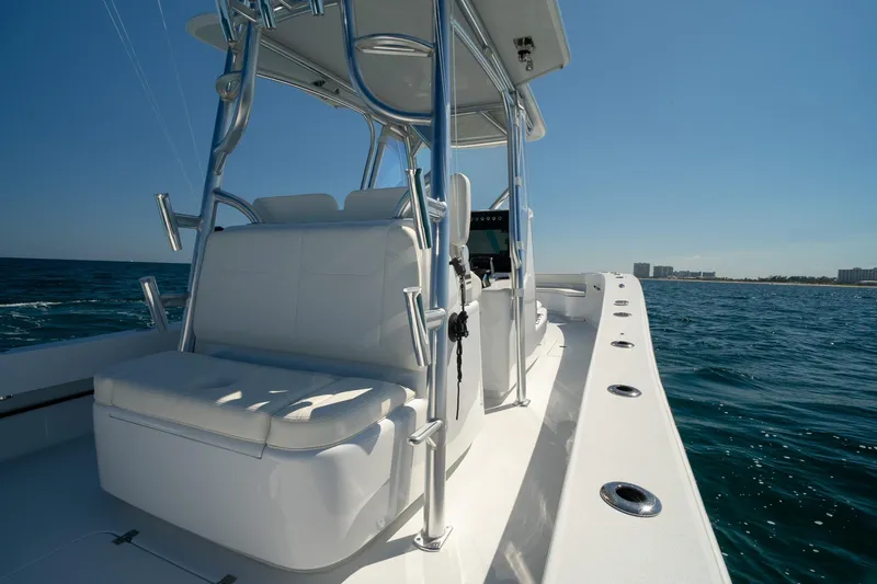 Slide: The Image of 2026 Conch 33 boat on open water, featuring sleek design and modern seating. - 25