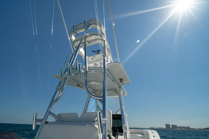 Slide: The Image of Tower of 2026 Conch 33 boat under clear blue sky and bright sun. - 26