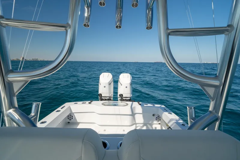 Slide: The Image of 2026 Conch 33 boat on open sea, featuring dual engines and sleek design. - 36