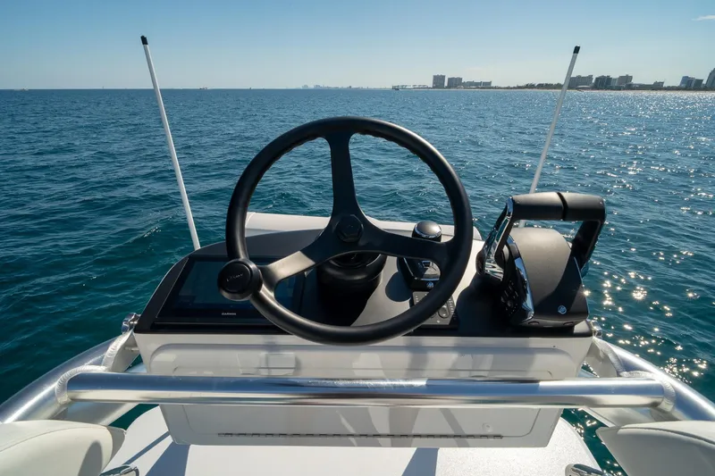 Slide: The Image of Steering console of 2026 Conch 33 boat on open sea. - 38